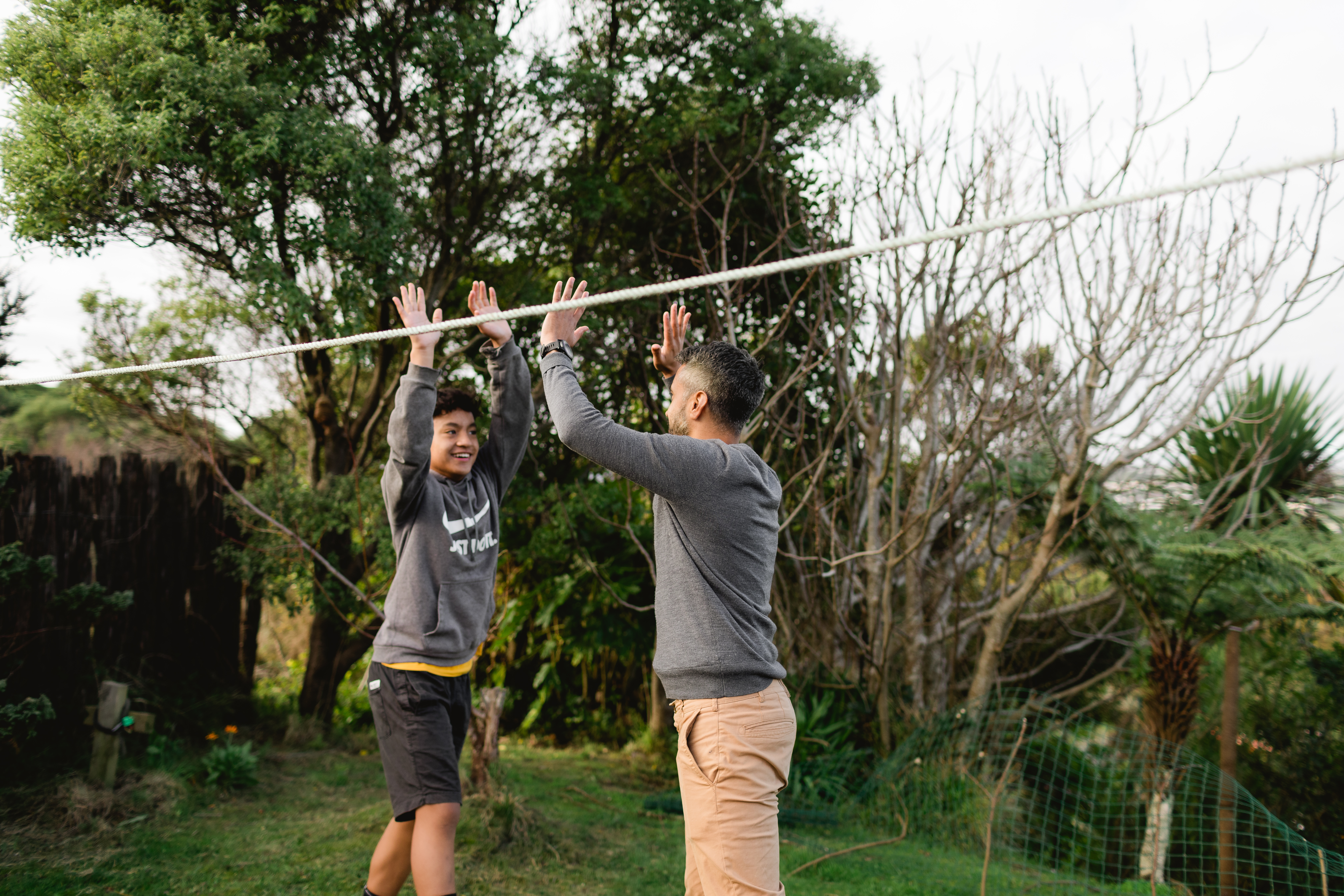 Father and son high five