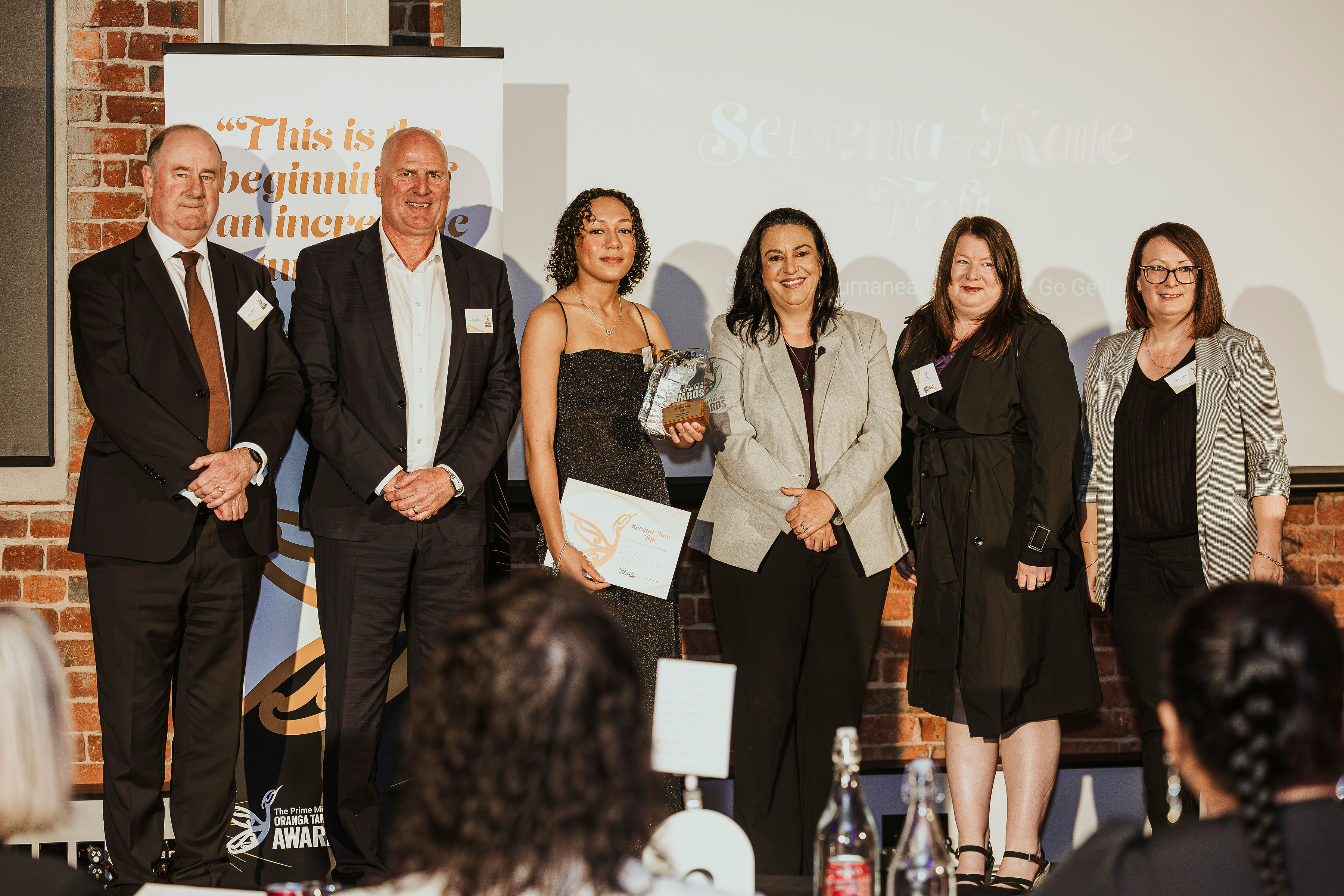 A Prime Minister's Oranga Tamariki Award recipient receiving their award.